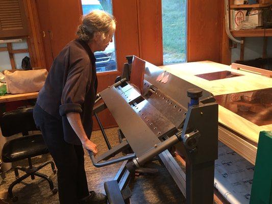 Jeanne folding a shingle