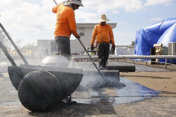 Hot Mopping of the first inner ply over insulation