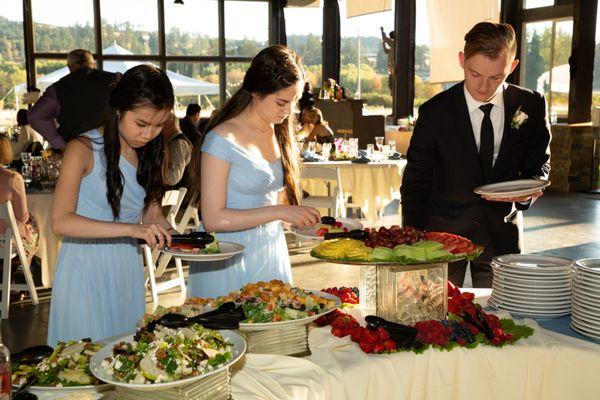 Bridal party going through the buffet
