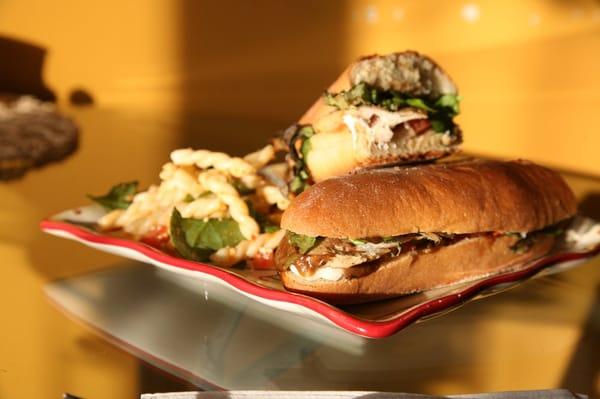 One of our signature sandwiches, the Arrostito. Grilled chicken, bruschetta, roasted peppers, mozzarella & balsamic vinaigrette