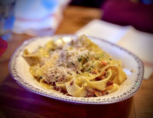 Fresh pappardelle, veal ragu bianco, salami, pork, milk, and fresh herbs.