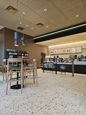 The ordering counter in the back of the middle of the store.