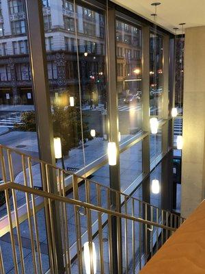 Stairwell and modern lighting near entrance.