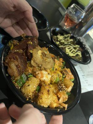 GAMERA TOTS-crispy tots with cheese sauce, shoyu-marinated fried egg, kimchi, Kaiju chile crunch and scallions