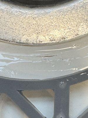 Flaking around sink drain.