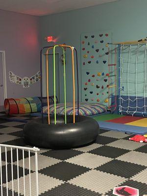 We have a rock wall, climbing set with monkey bars, and a jungle jumperoo. Including lots of sensory and textile toys on the walls.