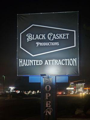 The front sign along the street.