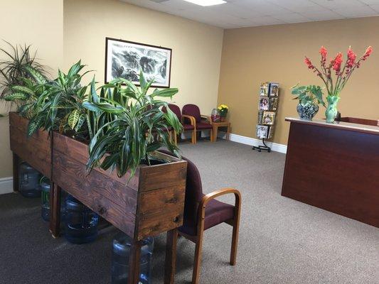 Open lobby and waiting room with comfortable seating and magazines