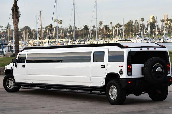 20 passenger H2 Hummer with a 5 inch extra high roof.