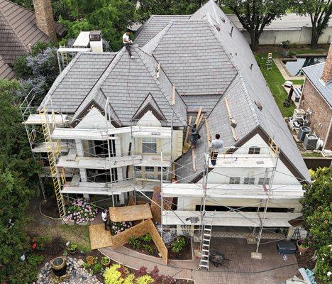 Roof: DaVinci Roofscapes Synthetic Slate - Brownstone
5" Half-round Guttering system
Stucco Re-dash
Custom Chimney Shroud
