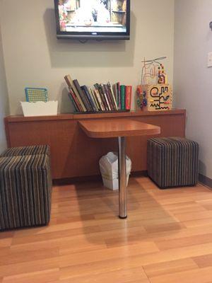 Play area for younger children while they wait. So smart!