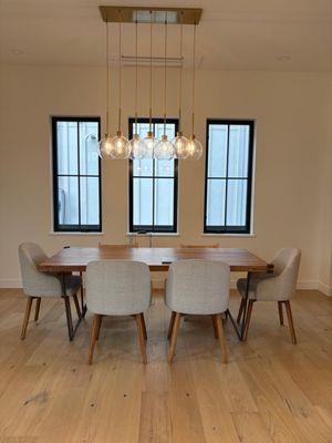 Clean, fresh, and eco-friendly. This dining room shines with natural light and a spotless finish using safe green products.