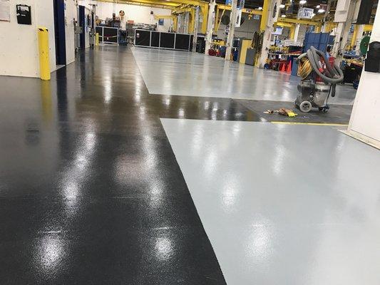 Industrial Floor Coating System. UPC 5500 Epoxy pigmented Black and Medium Gray with 2700 WB Urethane Top Coat.
