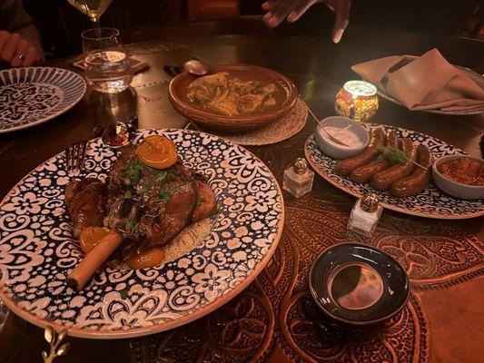 Lamb Shank Mrouzia, Chicken, Lemon and Olives Tagine and Merguez.