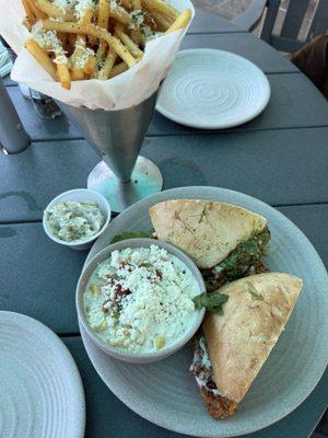 Chicken sandwich with side of street corn Truffle fries