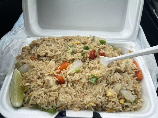 Basil fried rice (red and green peppers, green and white onion, tomatoes, eggs, basil, rice, and slice of lime)