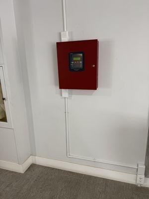 FireWatch devise placed right on the middle of the lobby when it should have been the laced in a closet where mechanicals are