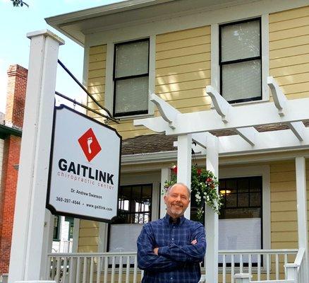 Dr. Swanson in front of Gaitlink Chiropractic Center in Port Gamble.