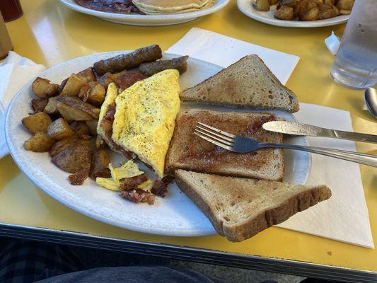 My breakfast corn beef hash omelette with home fries seasoned deep fried in the fryer