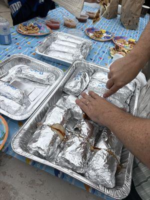 Catering trays of breakfast burritos: Carnitas, Chorizo, Egg & Cheese, and Bean Burritos- all delicious!