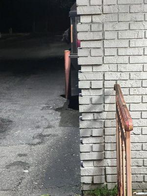 Employee on the phone hanging out of drive-through window