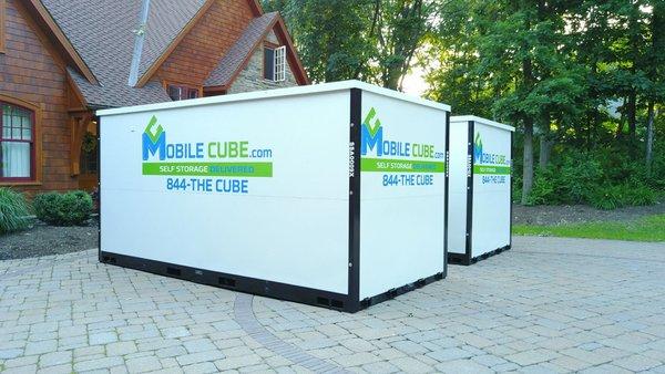 MobileCube storage cubes in a Bend driveway -- perfect for moving, renovations, or decluttering with secure portable storage.