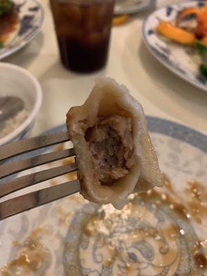 Tiny pork dumplings, thick chewy and doughy... where the meat?