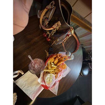 Breaded shrimp and fries and a margarita