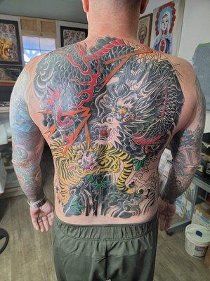 Full back, full body and as small as a dime tattoos I do, also 35 years doing body piercings as well as 44 years tattooing