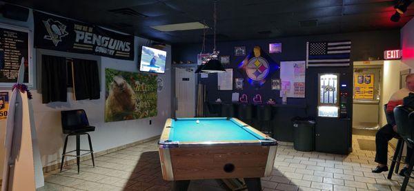 Pool table near women's room.