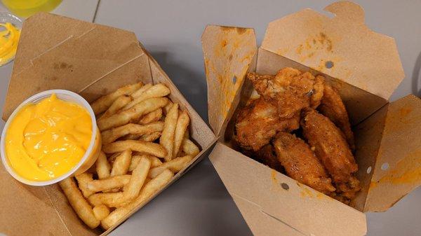 Cheese fries (cheese on the side) and Chili buffalo jumbo wings (spicy)