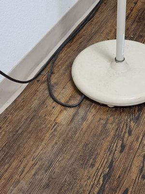 Collection of dust and dirt on exam equipment and floor