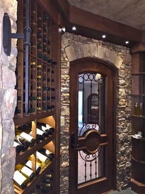 Alder-wood custom made wine racks highlight the craftsmanship in this unique wine cellar.