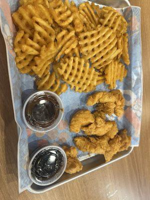 Boneless wings with sauce on the side and waffle fries!