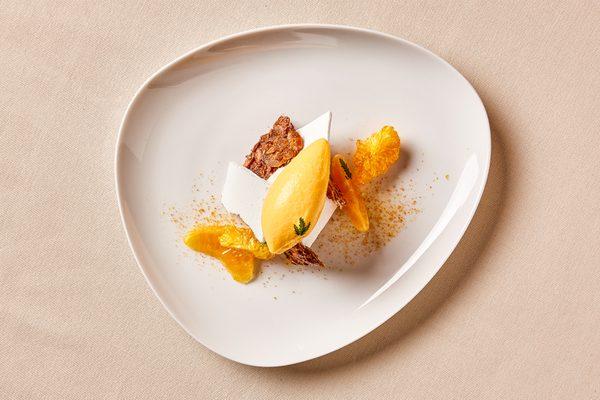 PAVLOVA Meringue, Spiced Ice Cream,
Tangerine Sorbet, Almond Brittle