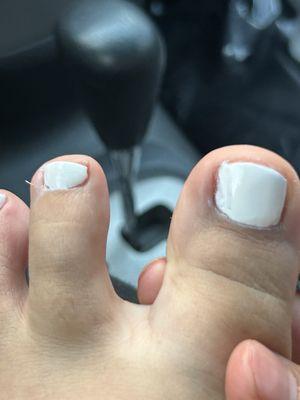 toe nail was set with gel despite the girl seeing that it wasn't painted properly.