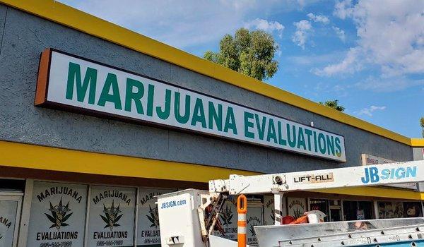 Metal sign cabinet with plastic sign panel and vinyl graphics.