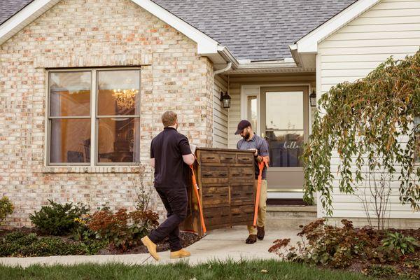 Careful delivery of a new solid wood dresser from Millwest Amish Furniture.