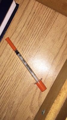 This needle was found in the bed. My bf picked it up and move it away&fastened the cap. This place is dirty. Do not stay here