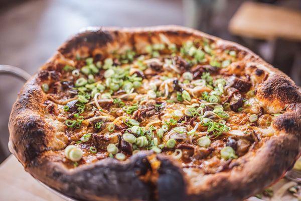 Blackstar's shito sauce
 roasted garlic
 mozzarella, provolone, & smoked scamorza
 roasted eggplant
 shaved yellow onion