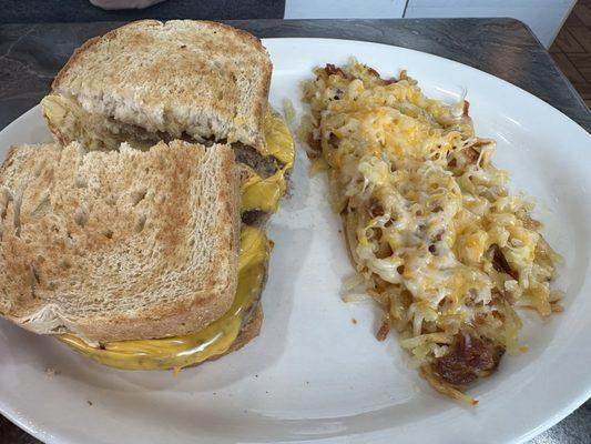 Sausage, egg& cheese on sourdough with cheese covered hash browns!