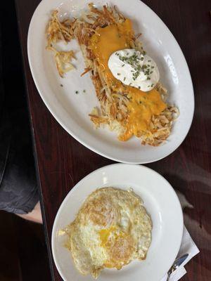 Stuffed hashbrowns and two supposed to be over medium eggs.