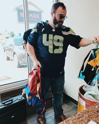 Rob with American Pacific Mortgage donating to the Marysville School District Stuff the Bus supplies drive!