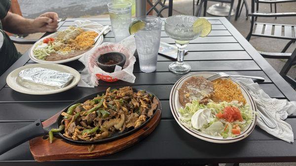 Chicken and steak fajitas. With rice and beans. Hubby had the chicken enchiladas
