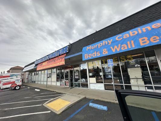 Outside of business. I love that the store sign states that they are NOT going out of business.