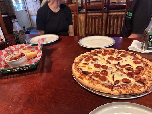 Solid pizza and breadsticks! Sauce has great flavor and found out the pepperoni was freshly sliced, and wasn't greasy.