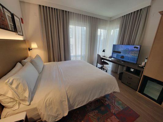 Bed, TV, office area