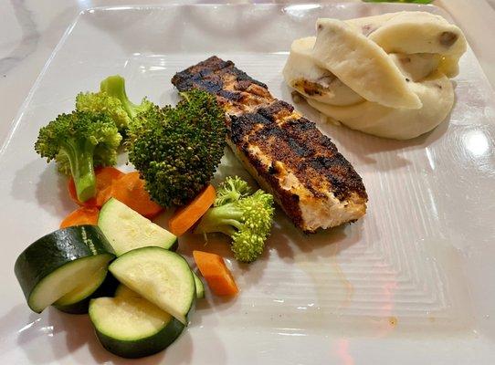 Blackened salmon filet with mashers and steamed veggies.