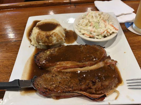 Meatloaf with mashed potatoes and cole slaw.