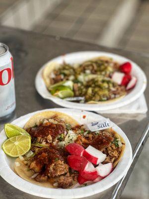 Carnitas tacos. Red salsa plate up front and Green salsa at the back.